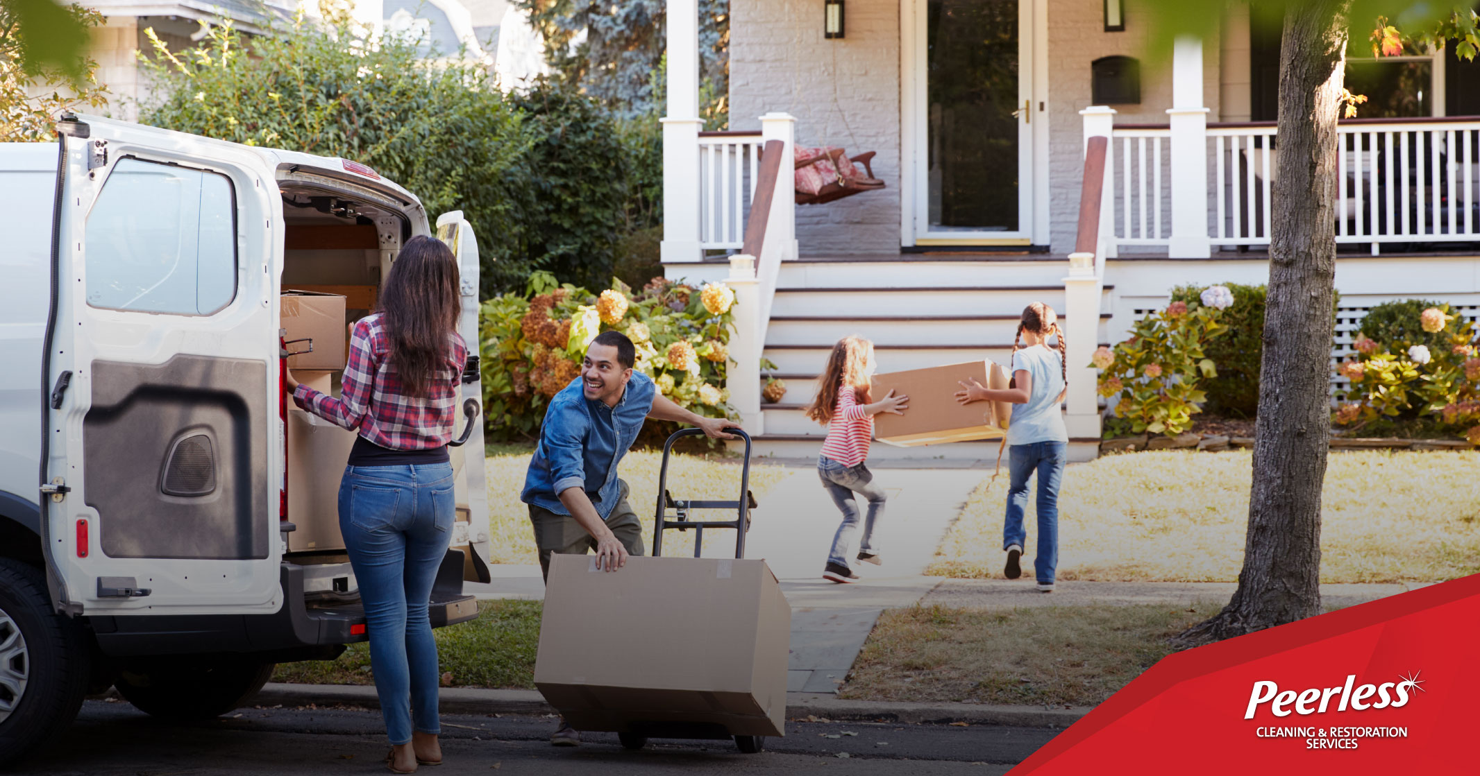 Family moving into a new home, caring boxes, with Peerless Cleaning & Restoration Services branding.